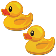 Two bright yellow rubber duck pasties on a white background.