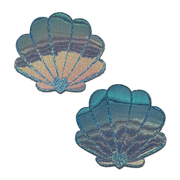 Two opalescent seafoam blue mermaid shell pasties with a glitter finish.