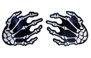 Skeleton hands nipple pasties with white bones on a black background.