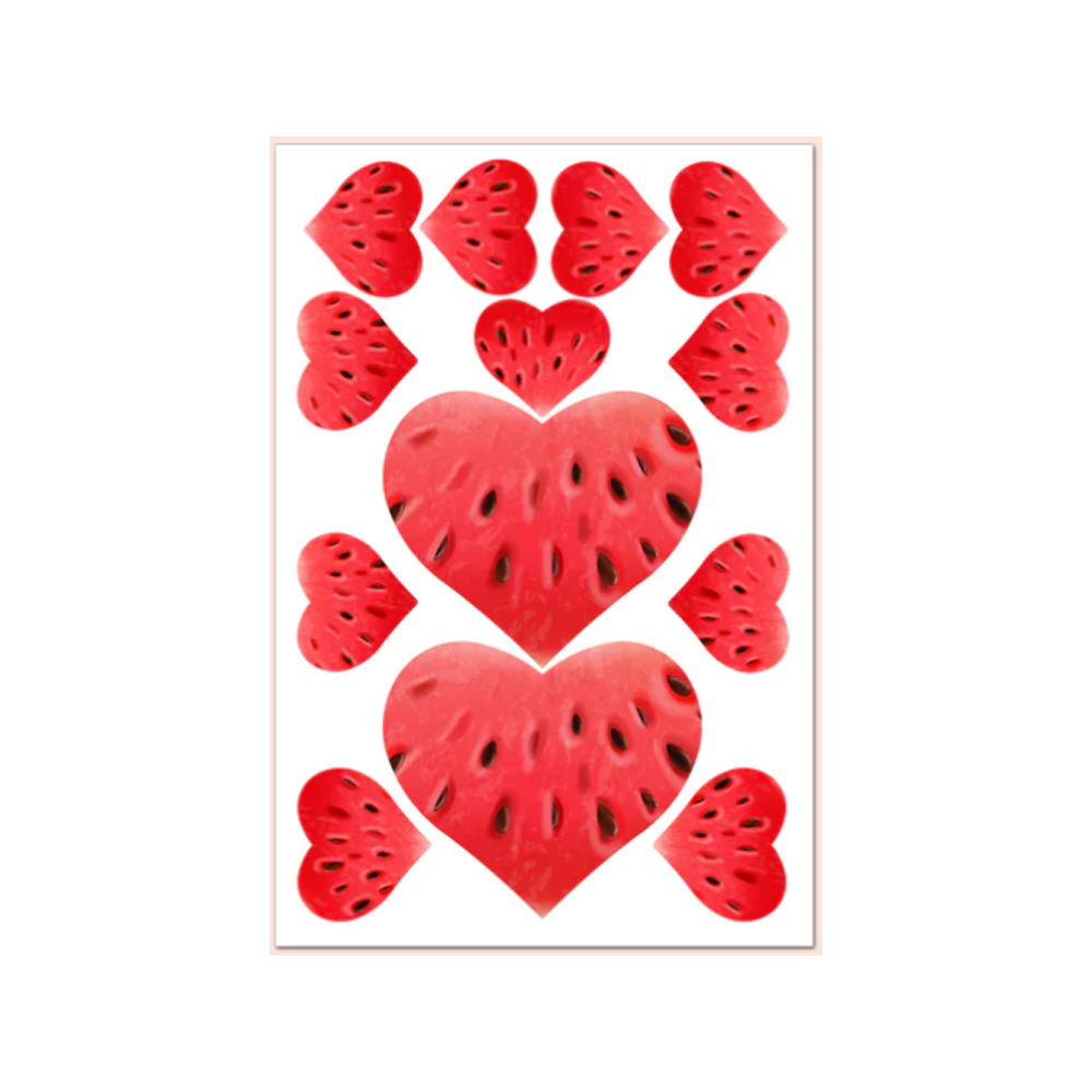Watermelon shaped edible pasties with black seeds.