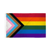 Progress Pride flag with rainbow stripes and chevron of black, brown, light blue, pink, and white.