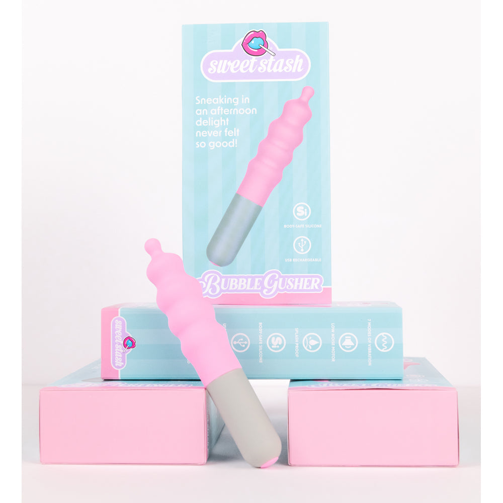 A pink and gray silicone vibrator with "Bubble Gusher" text.
