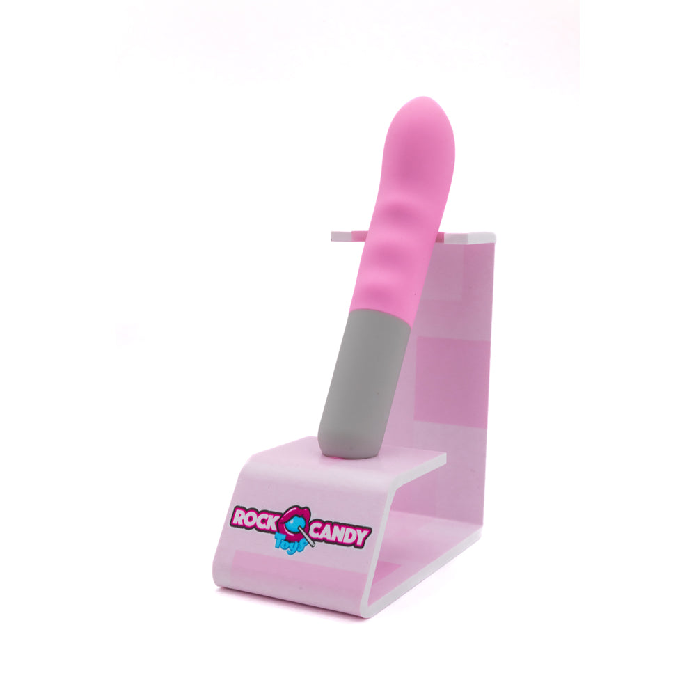 Pink and gray G-spot vibrator on a pink stand with Rock Candy Toys logo.