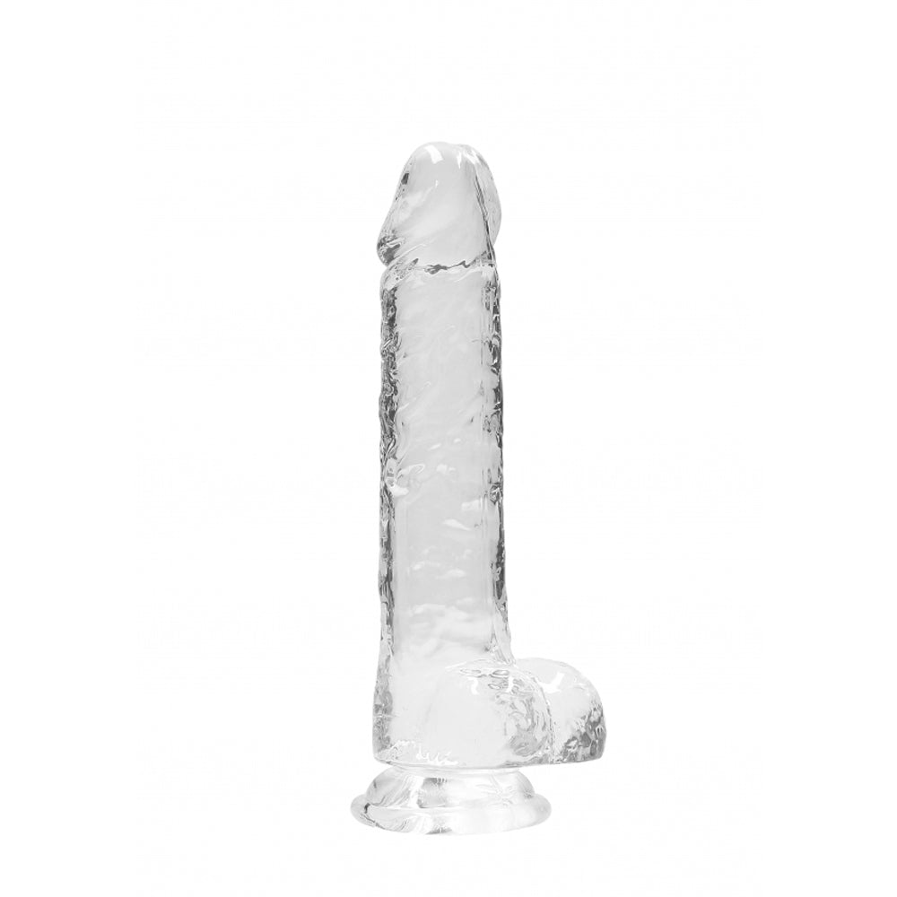 Clear glass dildo with suction cup base and textured shaft.