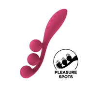 A pink silicone vibrator with three balls and control buttons.