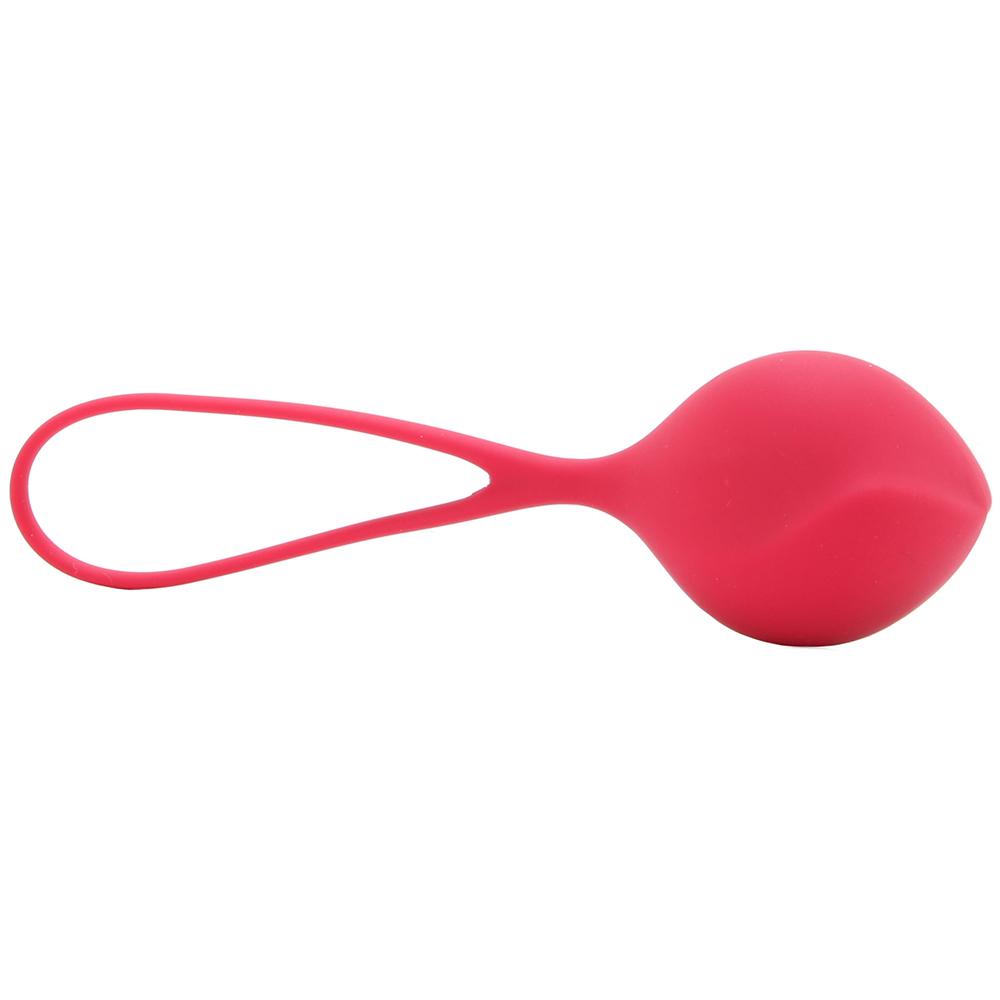 A pink silicone Kegel ball with a retrieval loop.