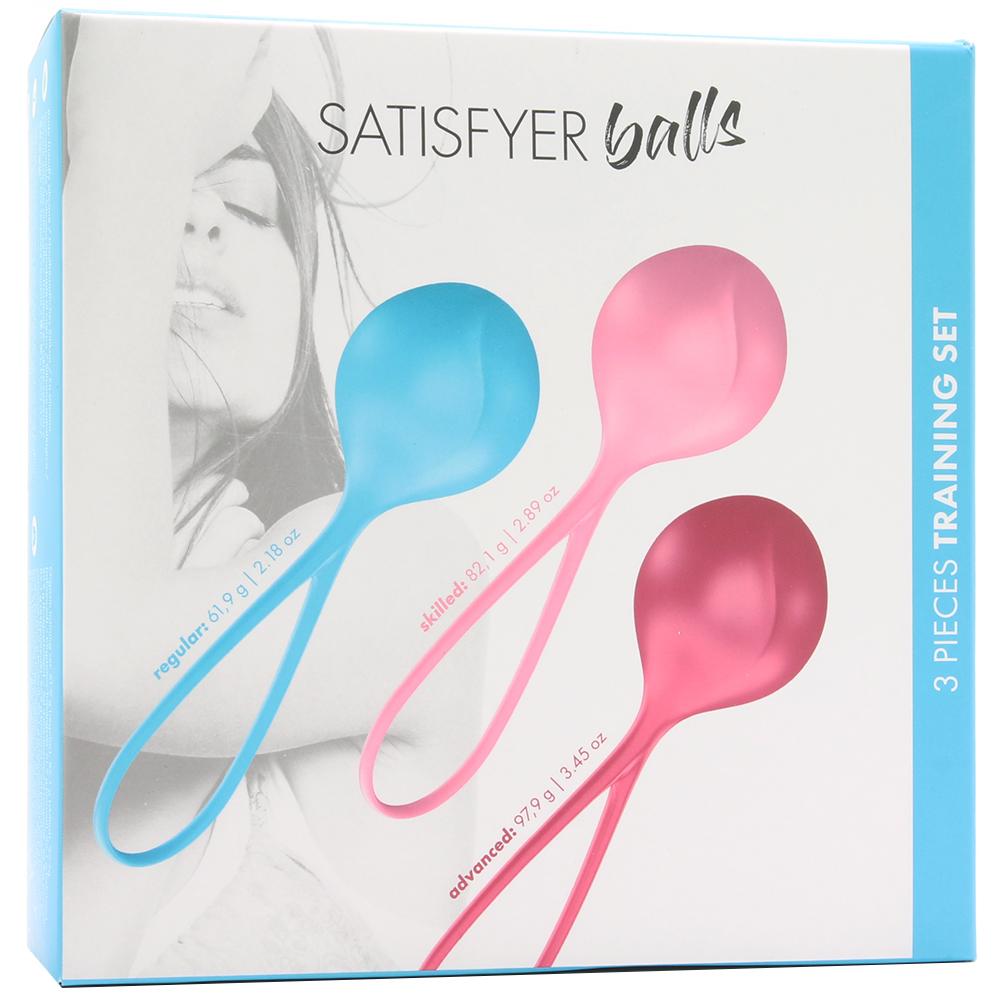 Satisfyer silicone training balls in blue, pink, and dark pink with weights listed.