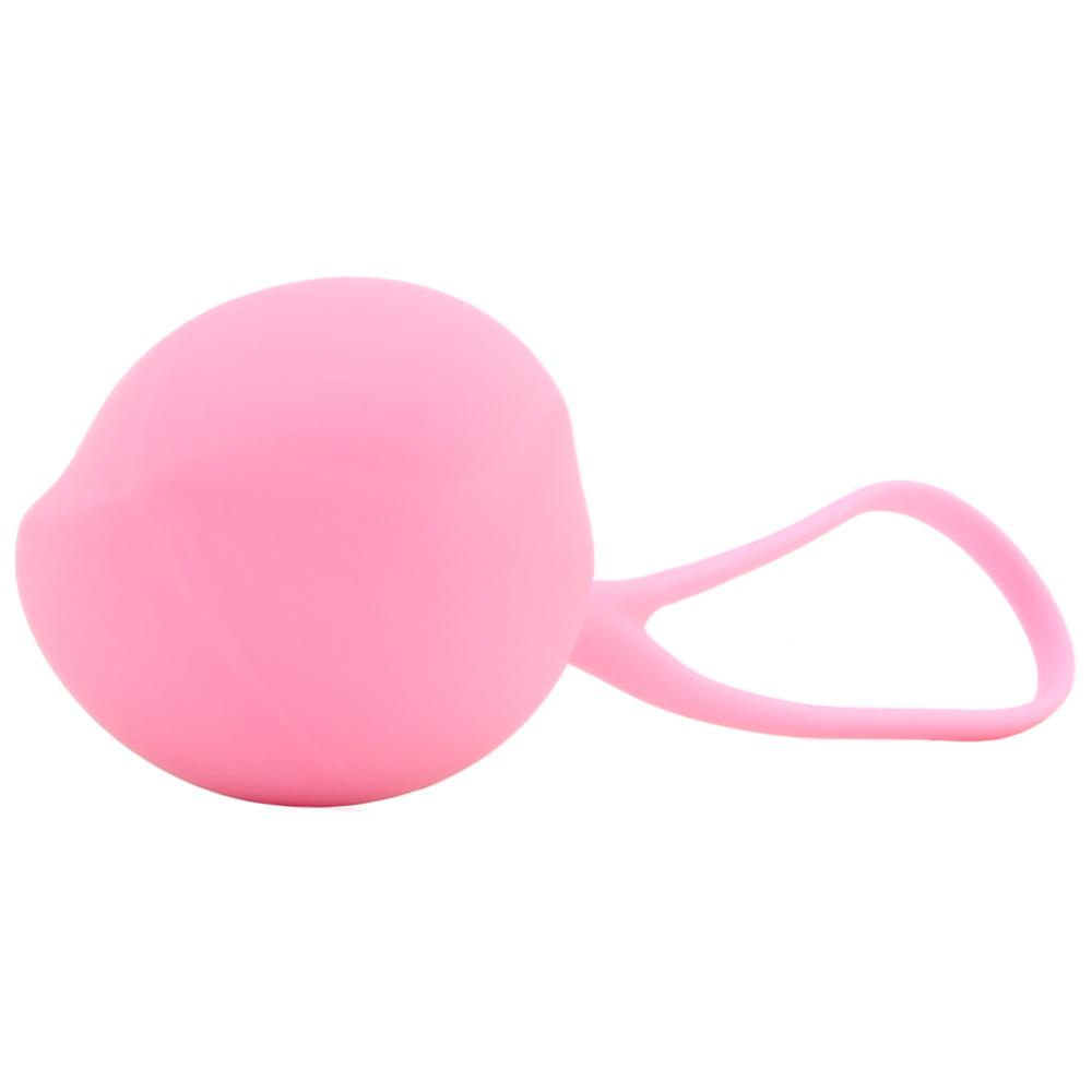 A pink silicone kegel training ball with a retrieval loop.