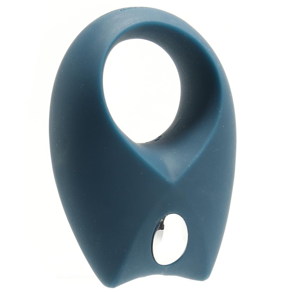 A blue vibrating cock ring with a silver button.