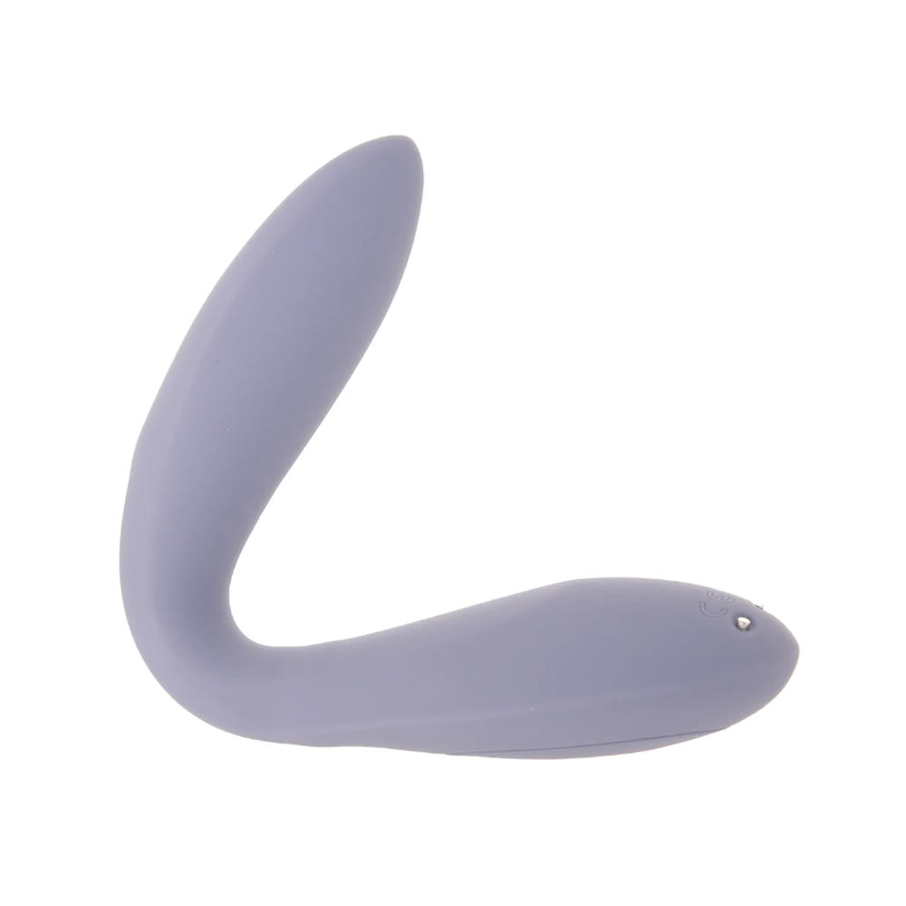A dark violet flexible silicone vibrator with a curved shape.