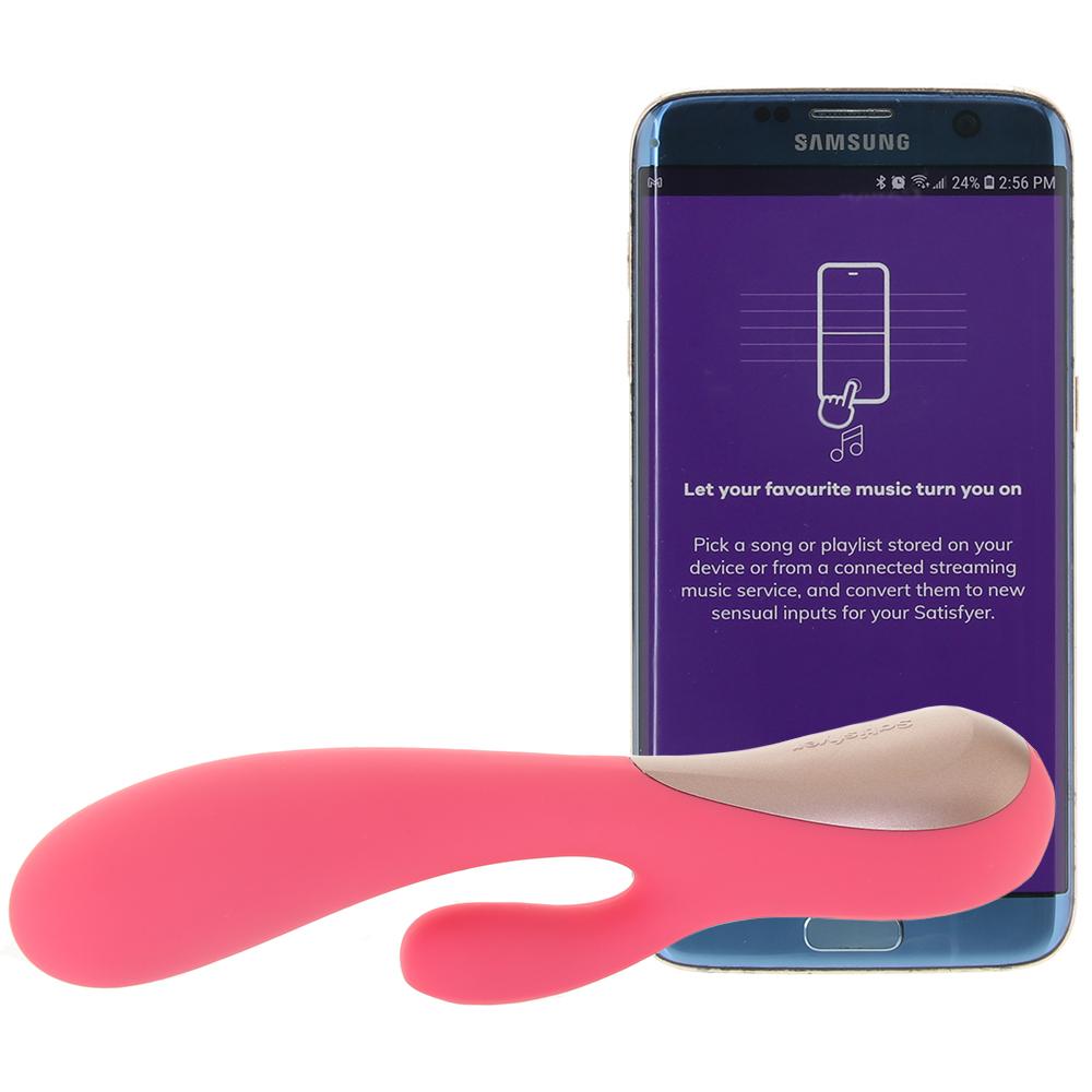 A pink and beige Satisfyer Mono Flex vibrator with a Samsung phone displaying the Satisfyer Connect app.