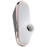 A portable vibrator with a white silicone head and a dark gray body, featuring a rose gold trim.