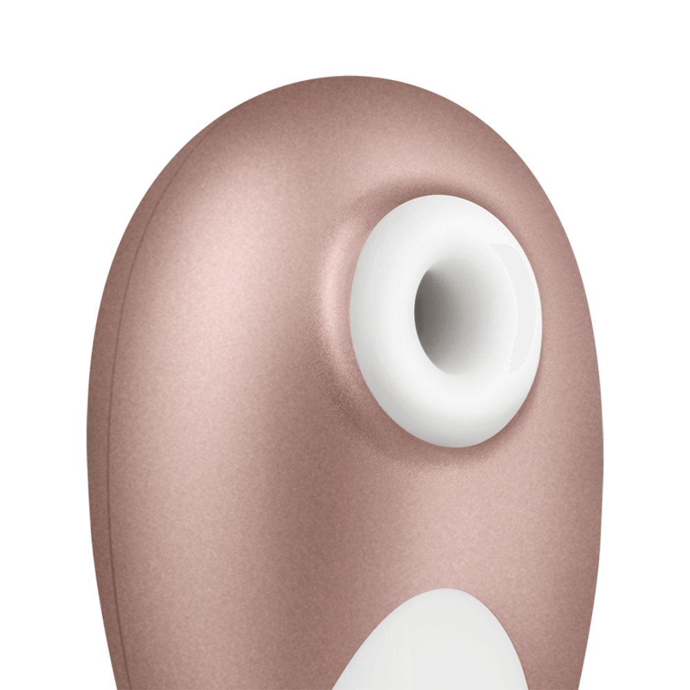 Rose gold clitoral vibrator with a white opening.
