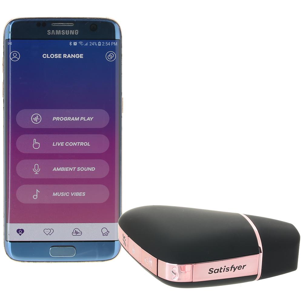 App-controlled clitoral vibrator with a black and rose gold design.