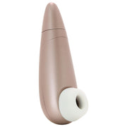 Rosy gold clitoral stimulator with a white silicone tip.