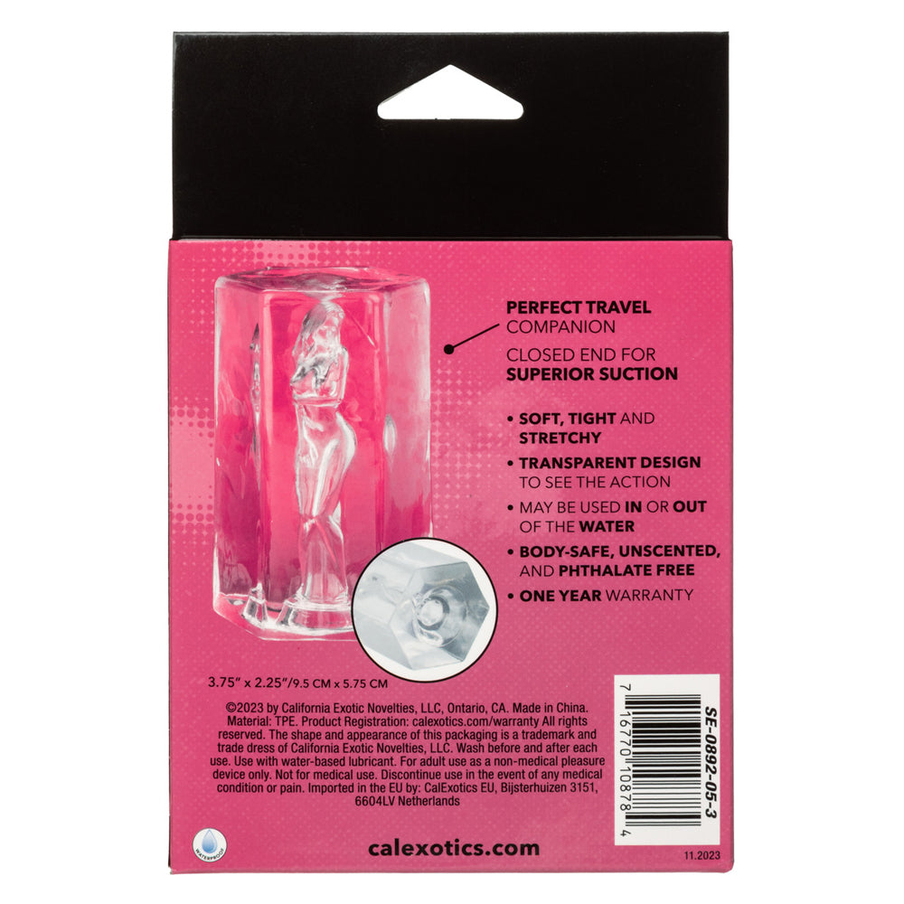 Transparent masturbator with a female figure inside, closed end for suction.