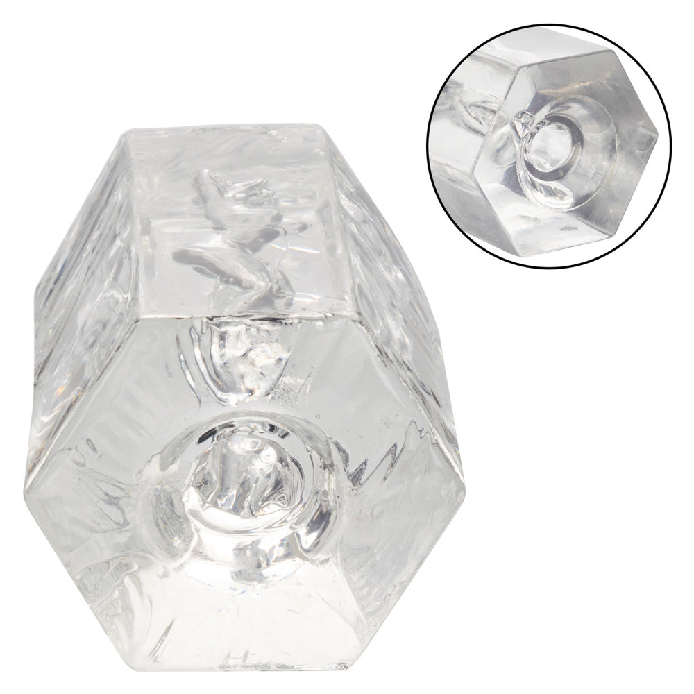 Transparent hexagonal glass object with a circular inset showing a close-up of the base.