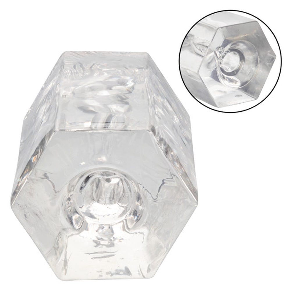 Transparent octagonal suction stroker with clear, stretchy material and inset view.