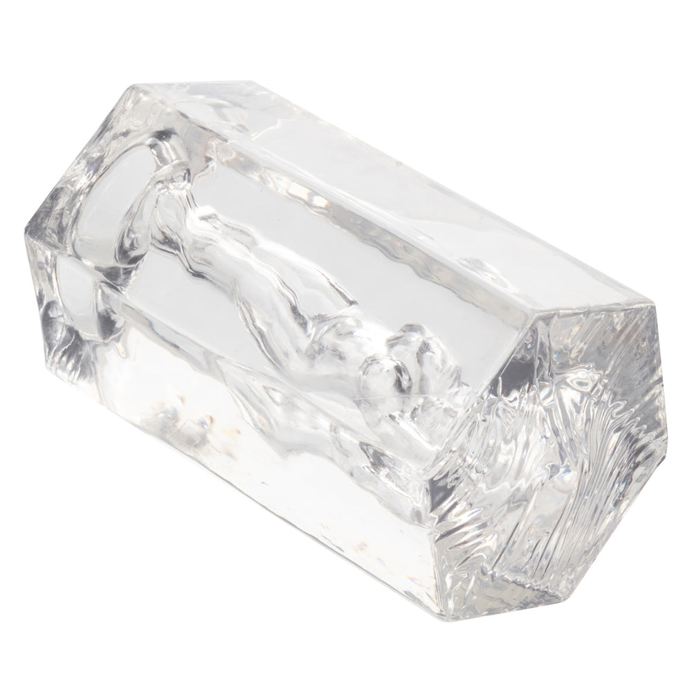 Transparent hexagonal suction stroker with clear, stretchy material.