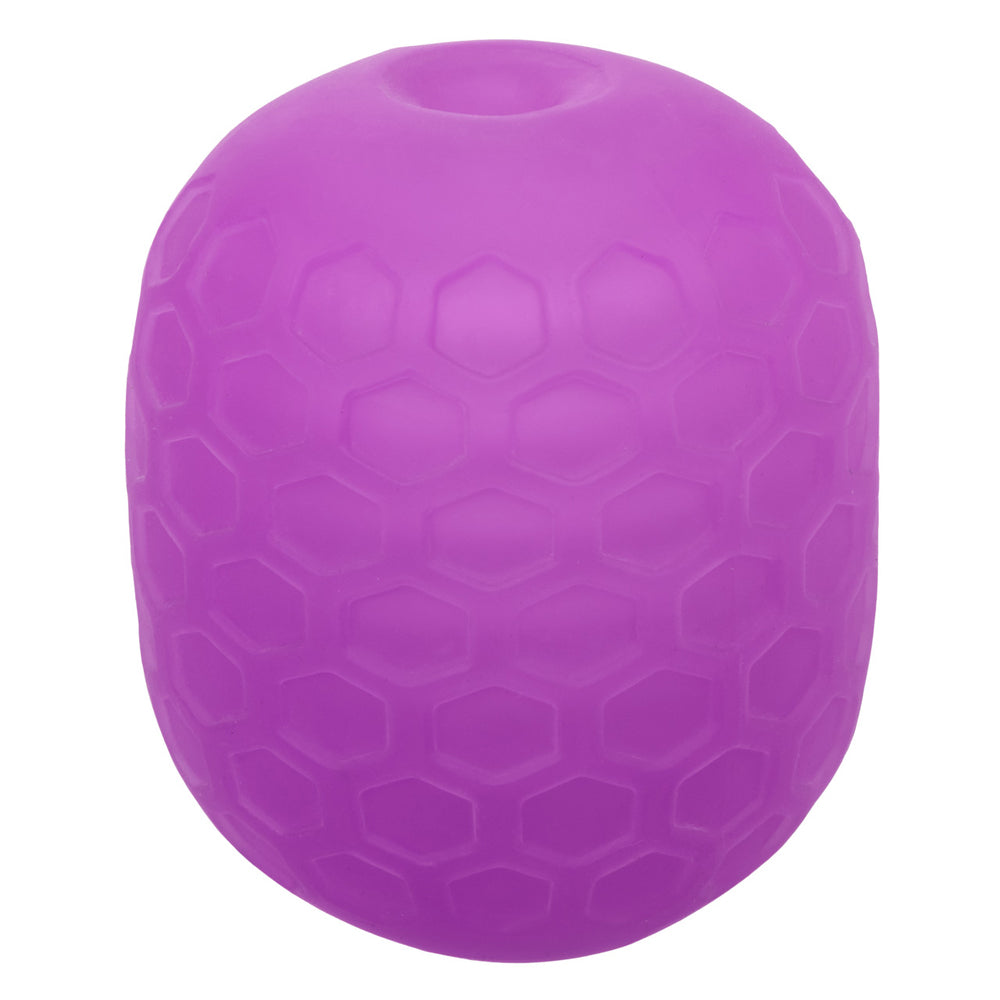 Purple textured stroker with a honeycomb pattern and a hole at the top.