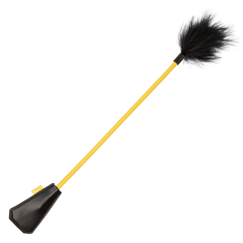Black feather tickler with a yellow handle and faux leather end.