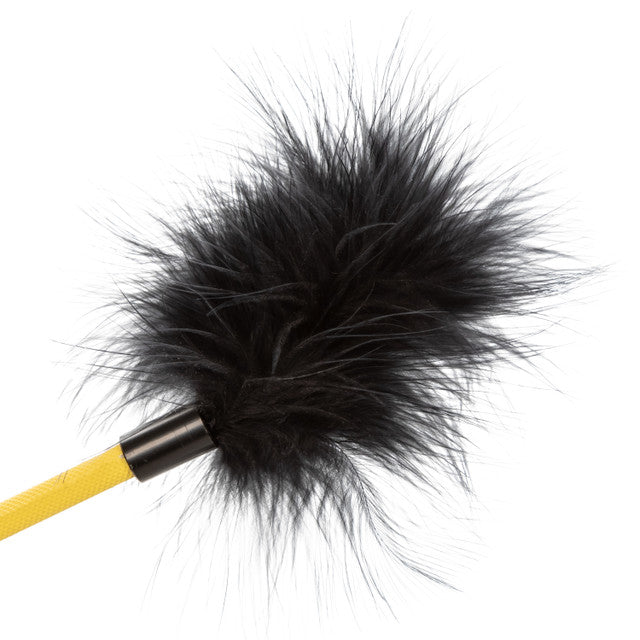 Black feather crop with a yellow handle.