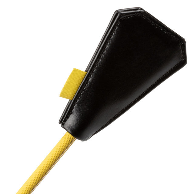 Black faux leather crop with yellow fabric loop and yellow cord.