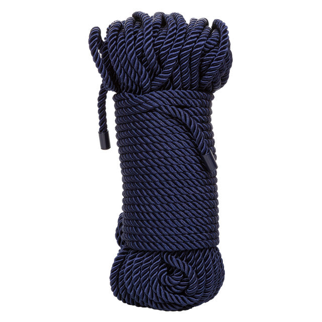 A coil of dark blue soft cotton rope for bondage.