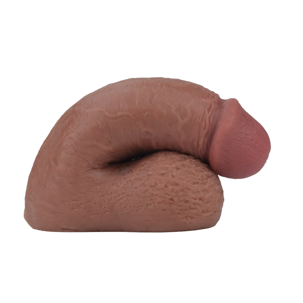 A 5-inch soft packing penis made from Pure Skin material, shown in a curved position.