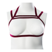 Metallic stretch chest harness with glittery straps on a mannequin.