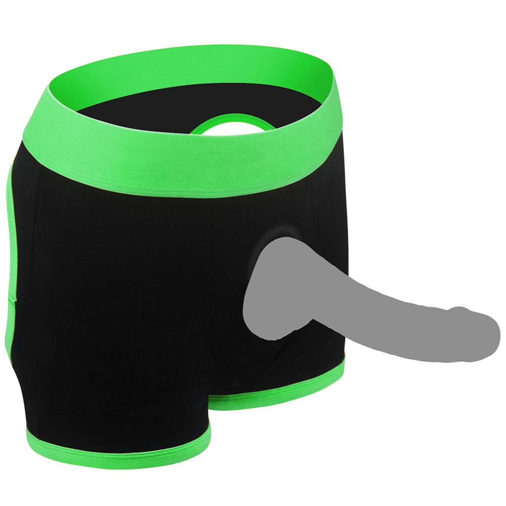 Black boxer shorts with green trim and a grey prosthetic penis.