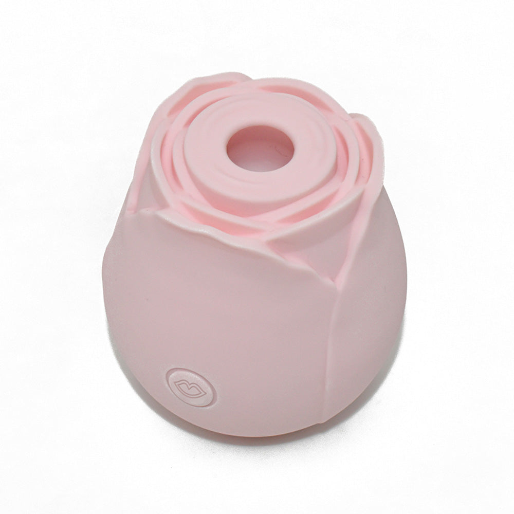Pink rose-shaped vibrator with a subtle lip imprint.