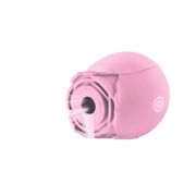 Pink rose-shaped massager with suction and vibration features.