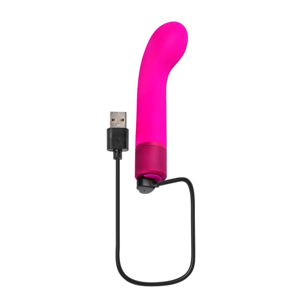 A pink G-spot vibrator with a USB charging cable.
