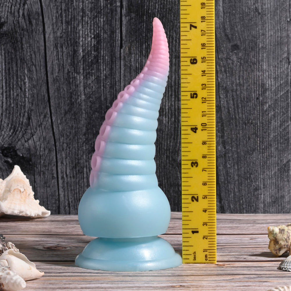 A blue and pink silicone tentacle toy with suction cups and a textured surface.