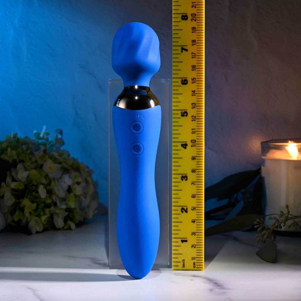 Blue dual motor rechargeable wand vibrator with textured head and bulbed base.