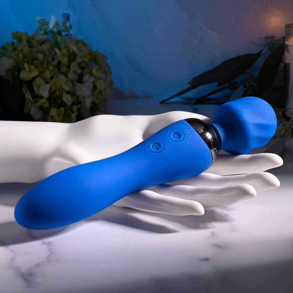 Blue dual motor rechargeable wand vibrator with textured head and bulbed vibrator.