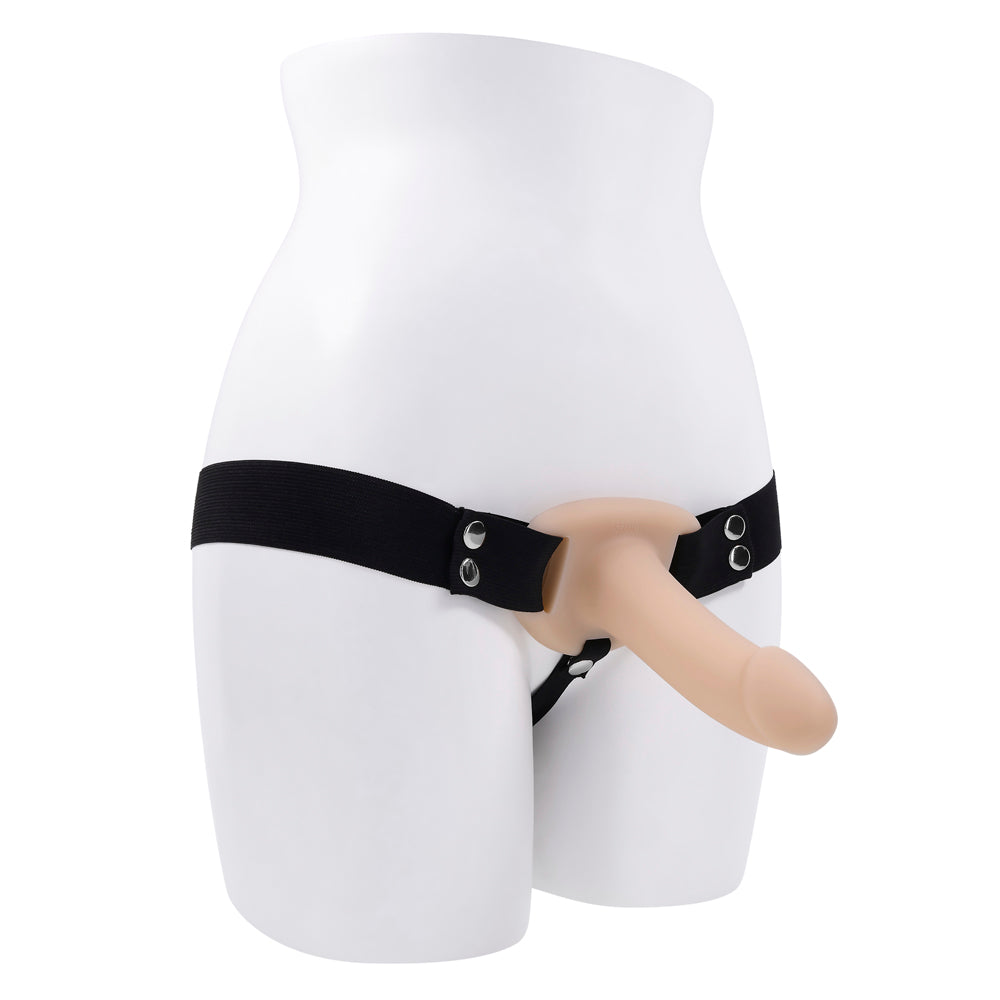 Hollow silicone strap-on dildo with black elastic harness on a mannequin.