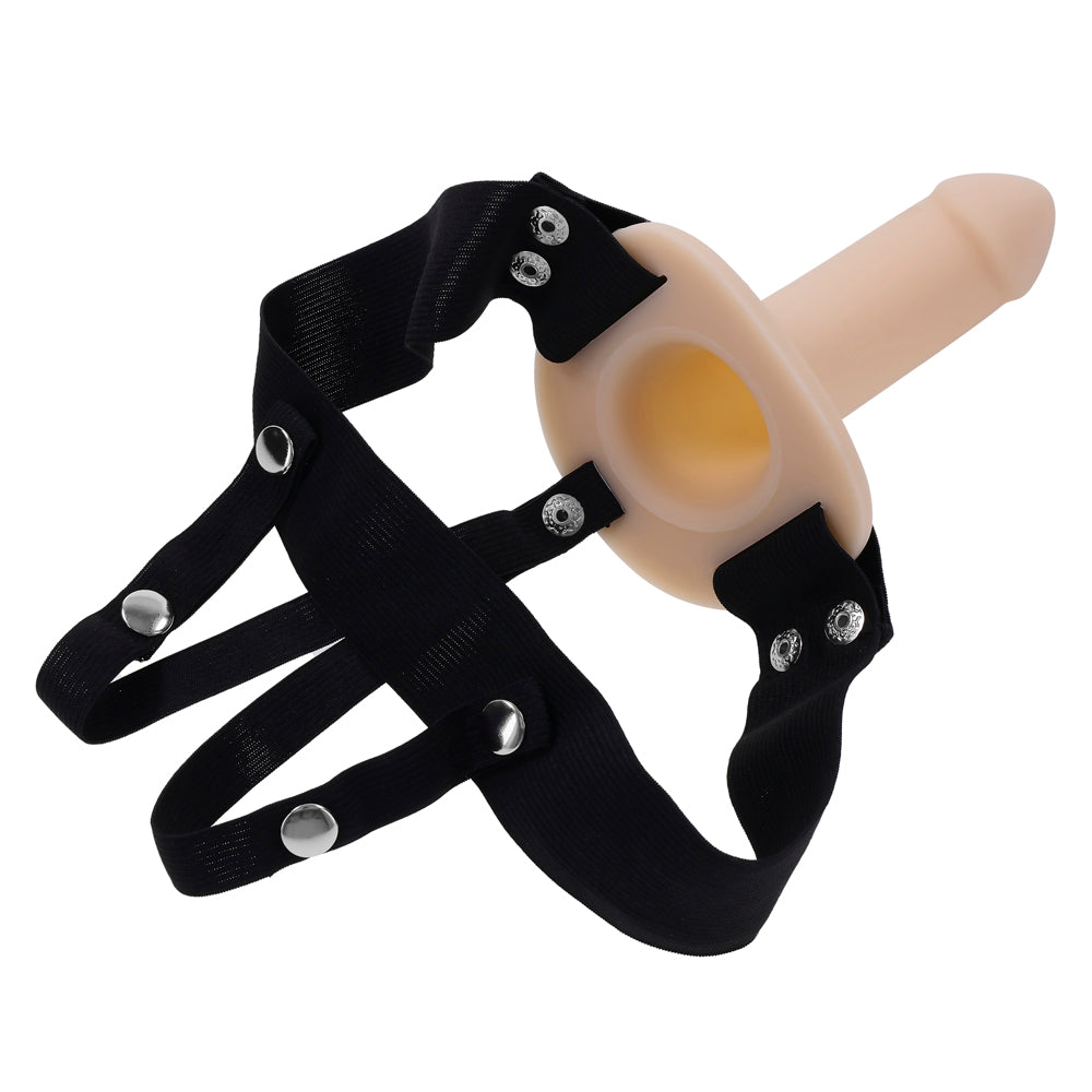 Hollow silicone dildo with a black elastic harness.
