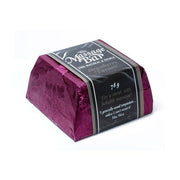 A purple wrapped massage bar with "The Massage Bar Strawberry Passion" printed on it.