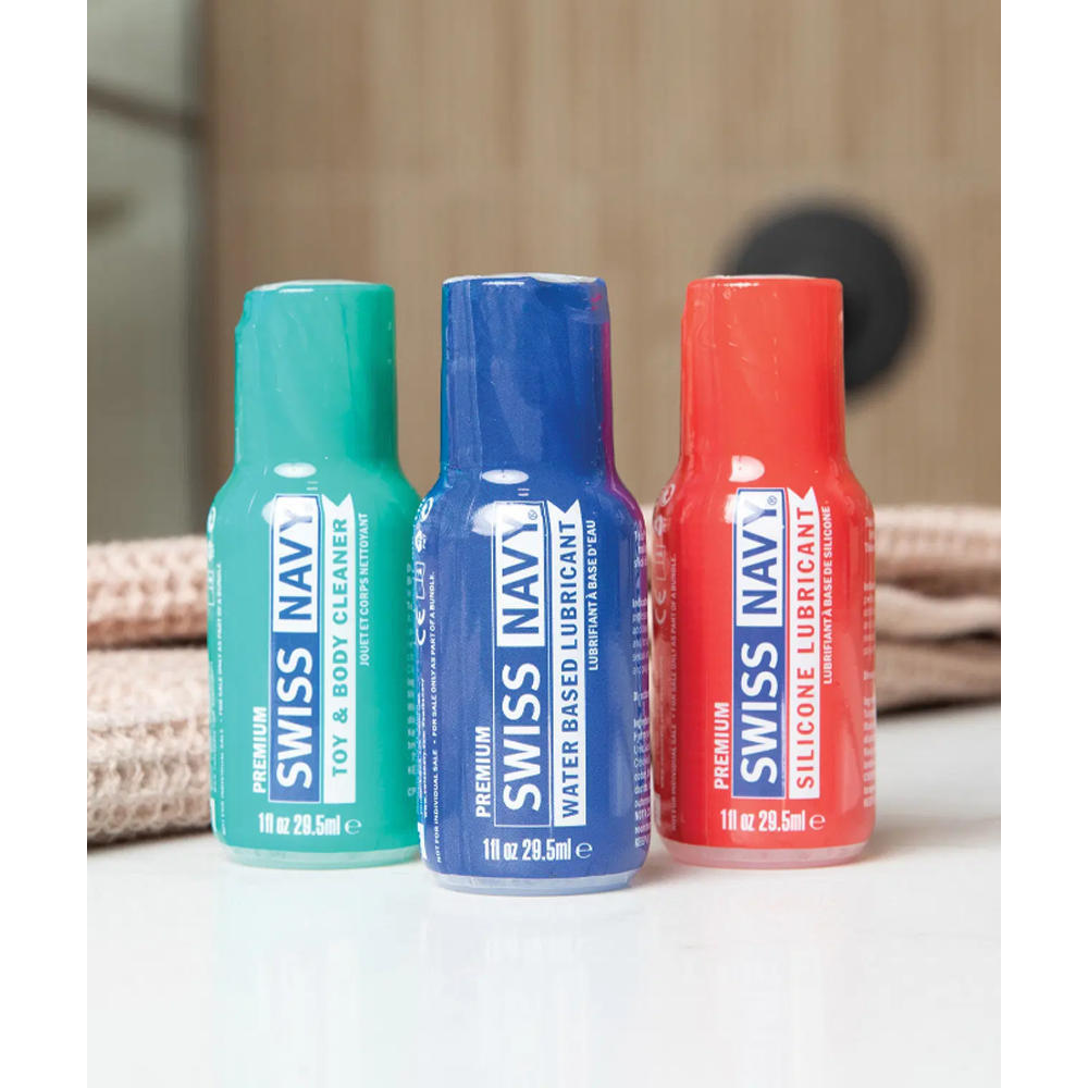 Three Swiss Navy bottles: toy cleaner, water-based lubricant, and silicone lubricant.
