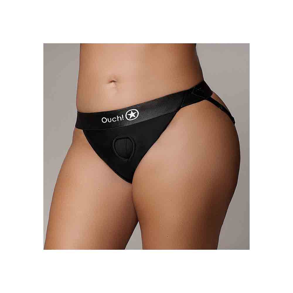 Black vibrating strap-on panty harness with Ouch! logo and O-ring.