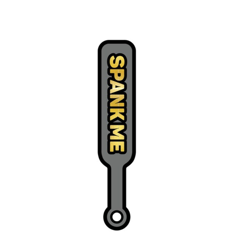 Gray enamel lapel pin with "SPANK ME" text.