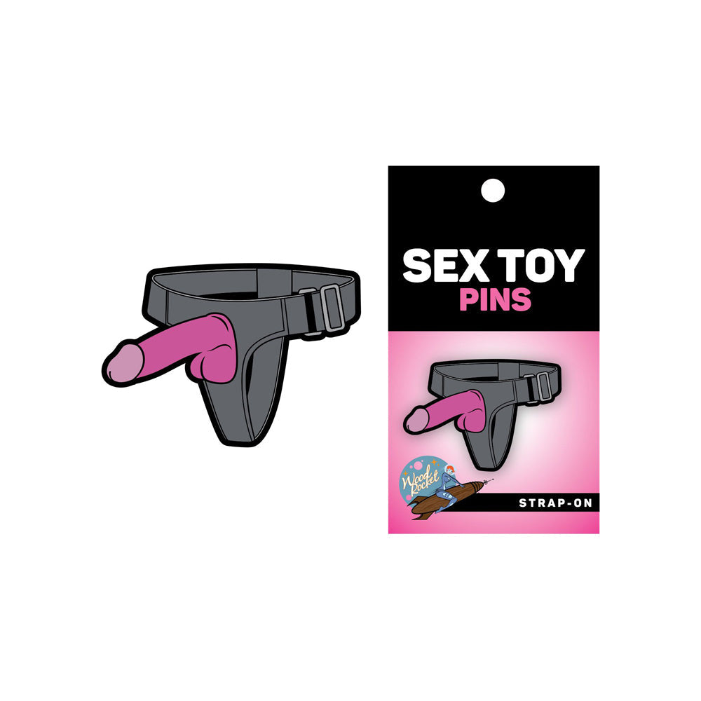 Grey and pink strap-on sex toy enamel lapel pin.