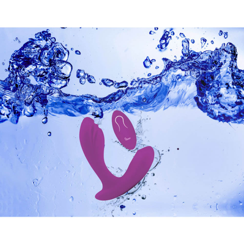 A purple G-spot vibe with a rollerball massager submerged in water.