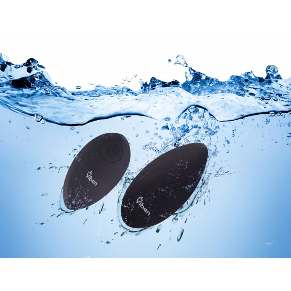 Two black, oval-shaped vibrators with the Viben logo submerged in water.