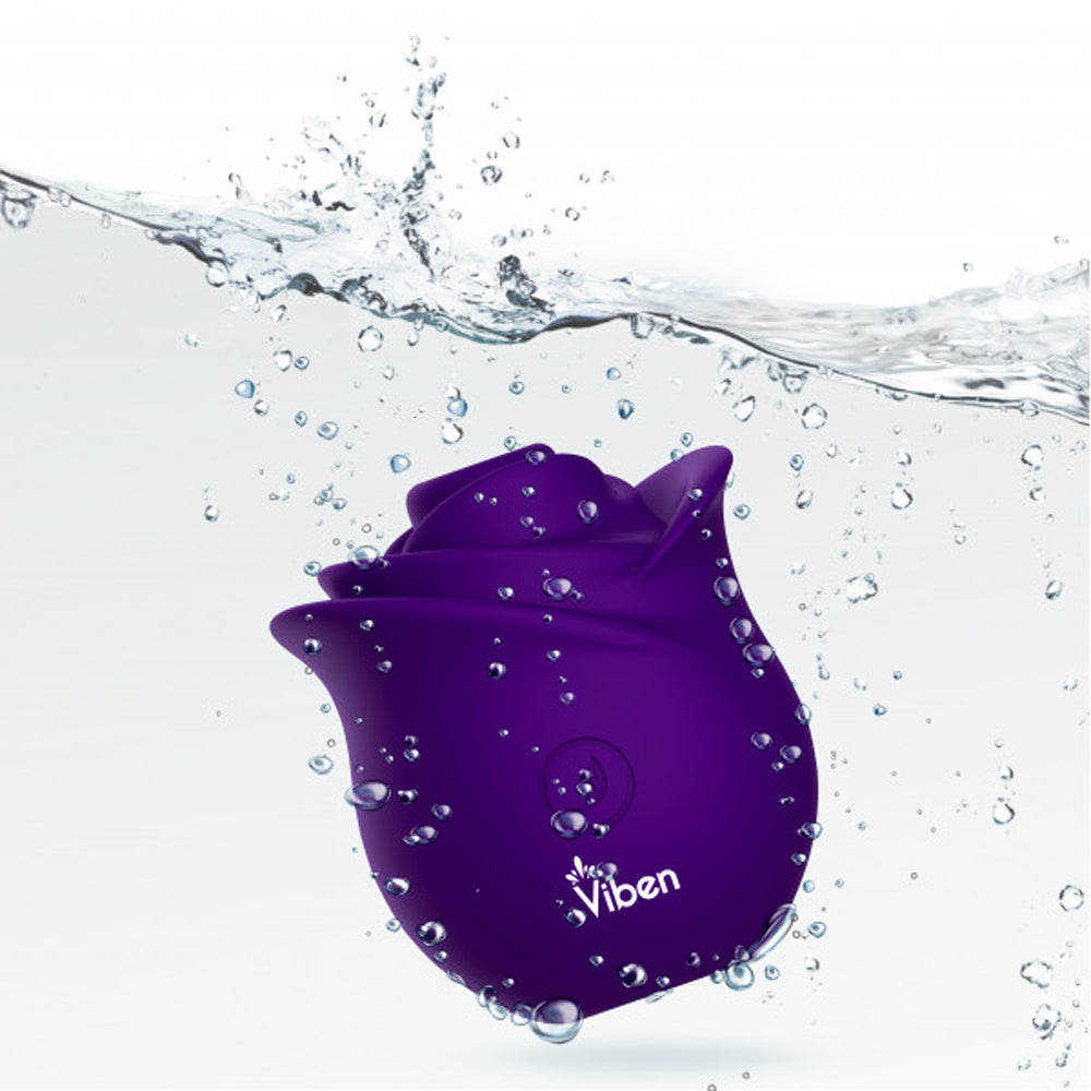 A purple rose-shaped suction stimulator by Viben submerged in water with air bubbles.