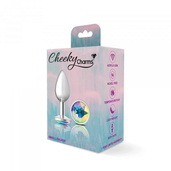 Small silver metal anal plug with a clear gemstone on a pink and blue box.