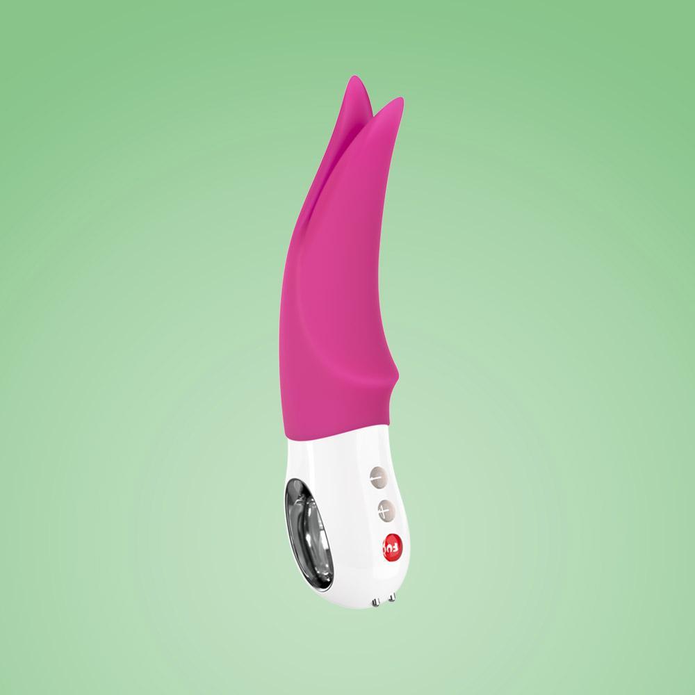 A pink and white clitoral vibrator with tapping tips.
