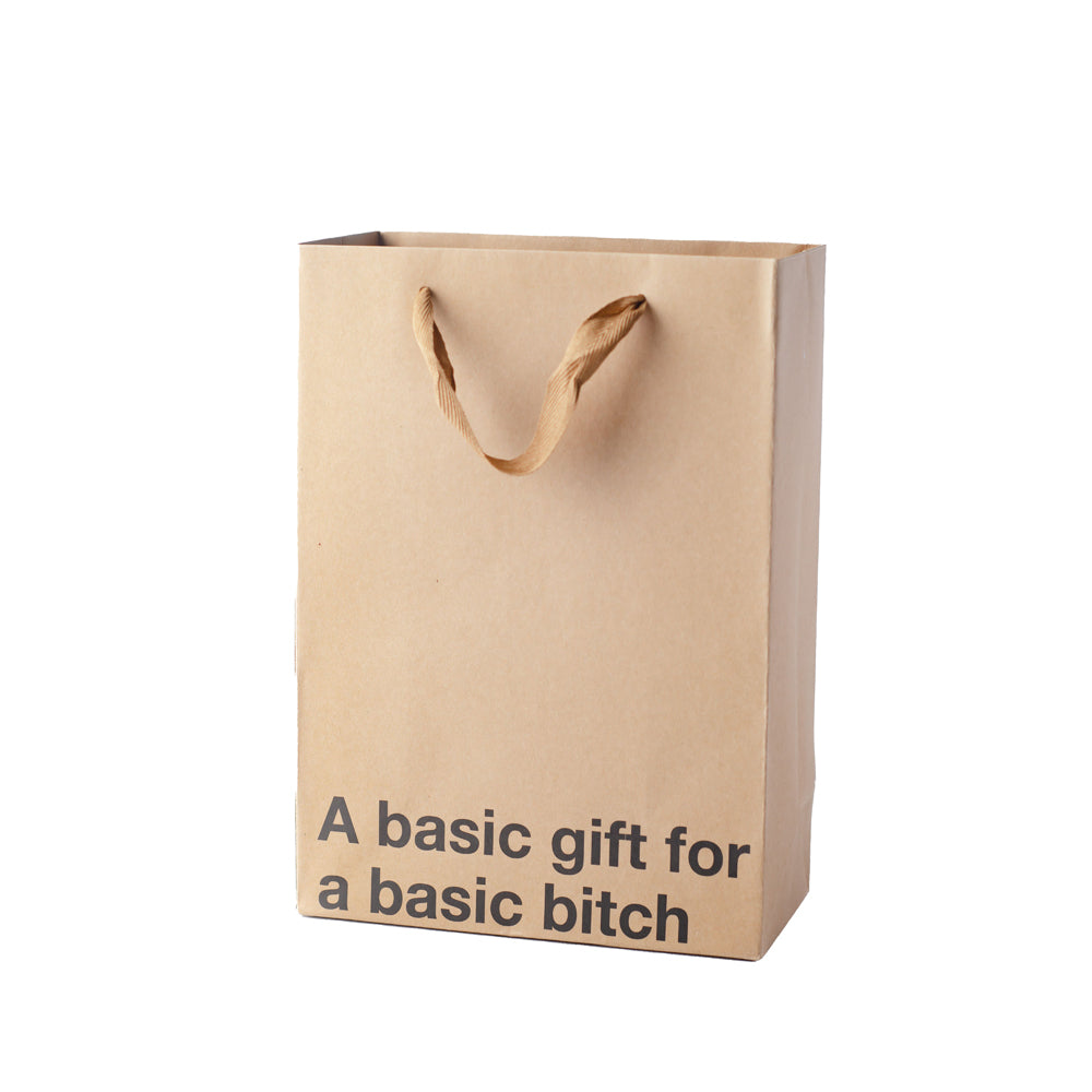 Kraft paper gift bag with "A basic gift for a basic bitch" text.